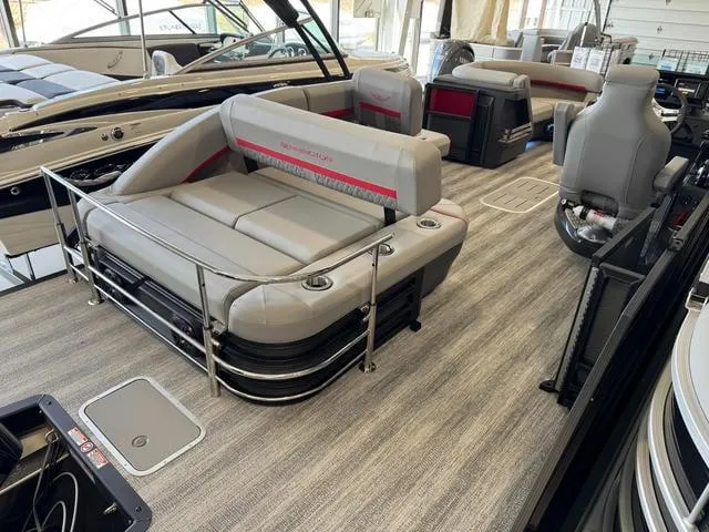 Slide: The Image of 2025 Bennington 22 MSB pontoon boat interior with plush seating and modern design. - 4