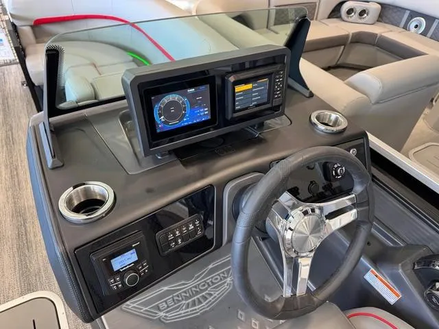 Slide: The Image of 2025 Bennington 22 MSB boat dashboard with modern controls and dual displays. - 6