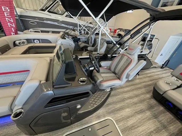 Slide: The Image of 2025 Bennington 22 MSB boat interior with modern helm and seating. - 7