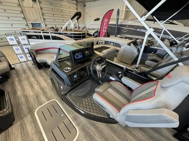 Slide: The Image of 2025 Bennington 22 MSB pontoon boat interior with modern dashboard and seating. - 9