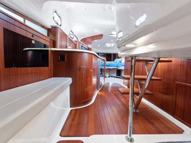 Slide: The Image of 2018 Pursuit OS 385 Offshore yacht interior with elegant wood finish and modern design. - 31