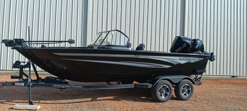 Slide: The Image of 2025 Ranger VX1888 WT boat on trailer, sleek black design, parked outdoors. - 0