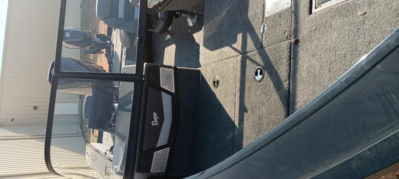 Slide: The Image of 2025 Ranger VX1888 WT boat interior with carpeted flooring and seating. - 10