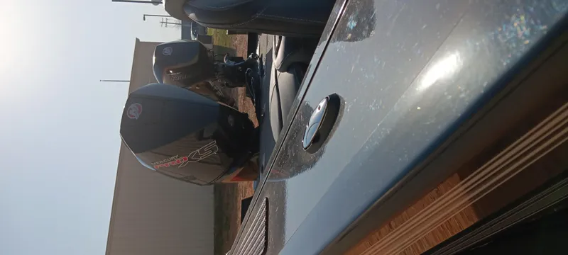 Slide: The Image of 2025 Ranger VX1888 WT boat with powerful outboard motor, viewed from the side. - 13