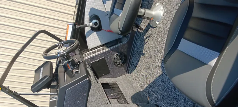 Slide: The Image of 2025 Ranger VX1888 WT boat interior with steering wheel and seating. - 16