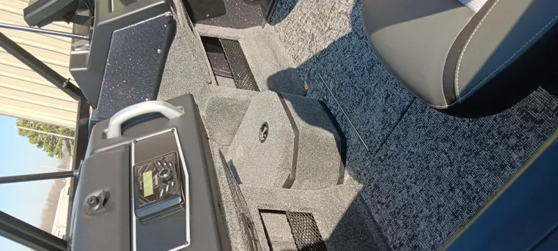 Slide: The Image of 2025 Ranger VX1888 WT boat interior with modern dashboard and seating. - 17