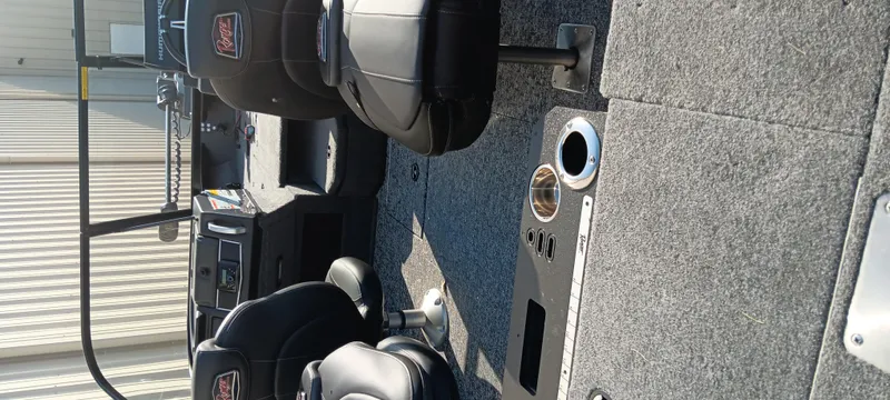 Slide: The Image of 2025 Ranger VX1888 WT boat interior with black seats and carpeted flooring. - 5