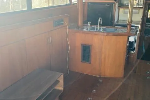 Slide: The Image of 1987 President 36 yacht interior with wooden cabinetry and kitchenette. - 13