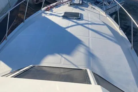 Slide: The Image of 1987 President 36 yacht deck with railing and hatch, viewed from above. - 2