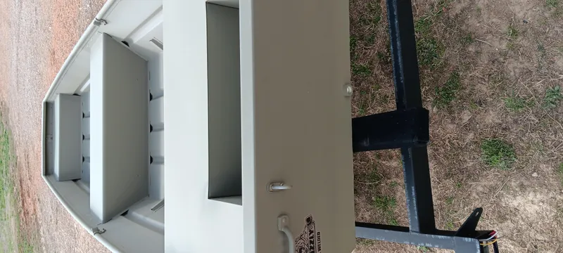 Slide: The Image of 2025 Tracker Grizzly 1436 Utility boat on trailer, viewed from above. - 4