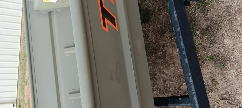 Slide: The Image of 2025 Tracker Grizzly 1436 Utility boat on trailer, side view. - 6