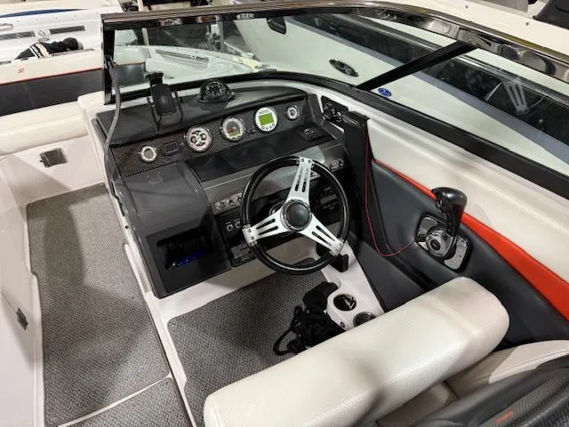 Slide: The Image of 2016 Four Winns TS242 boat interior with modern dashboard and steering wheel. - 3