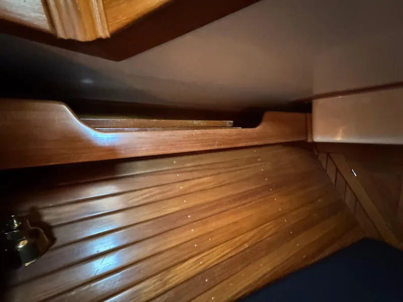 Slide: The Image of Interior view of 1988 Cabo Rico 38XL sailboat with wooden paneling. - 19