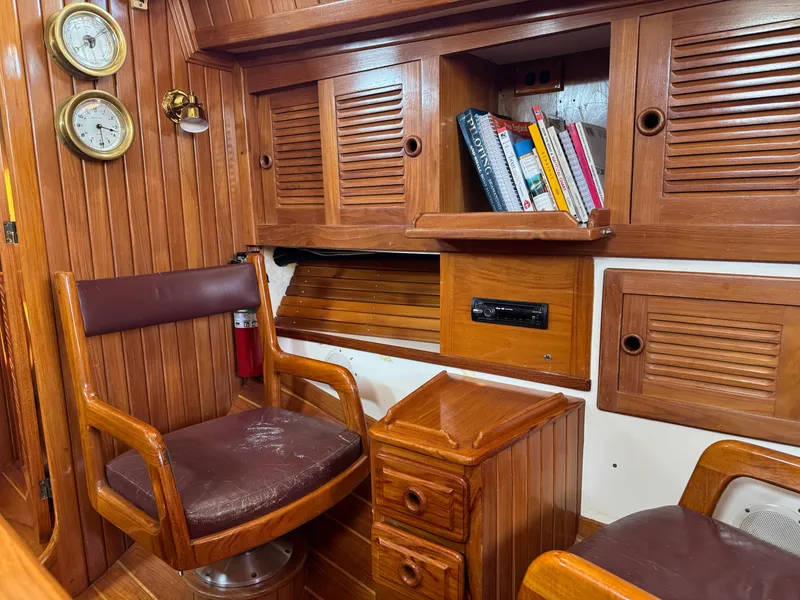 Slide: The Image of Interior of 1988 Cabo Rico 38XL sailboat with wooden cabinetry and seating. - 33