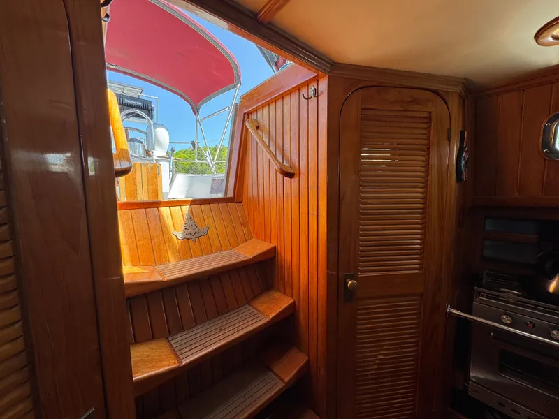 Slide: The Image of Interior of 1988 Cabo Rico 38XL sailboat with wooden stairs and cabinetry. - 41