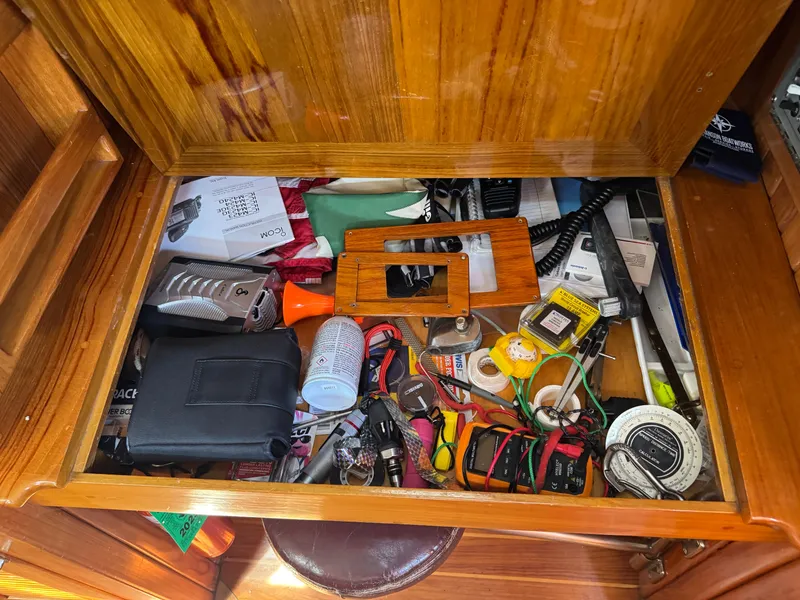 Slide: The Image of Drawer filled with assorted tools and items on a 1988 Cabo Rico 38XL yacht. - 44