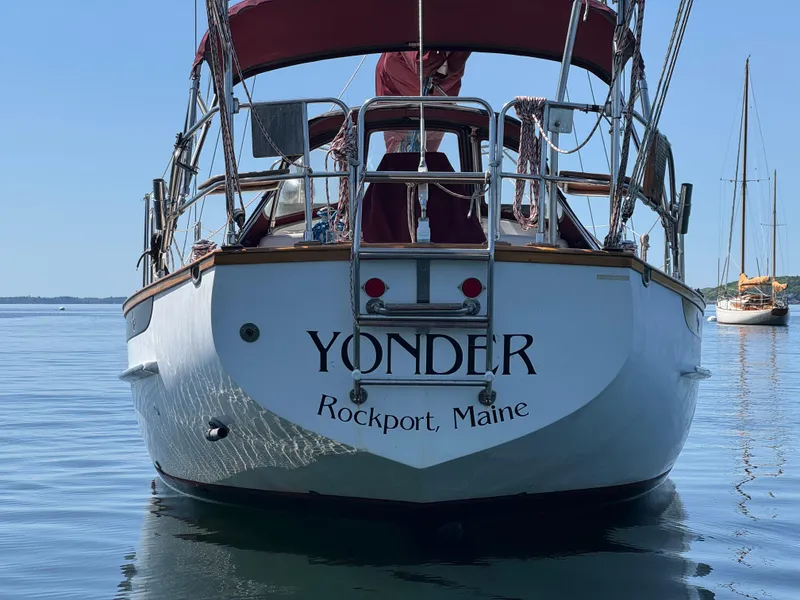 Slide: The Image of 1988 Cabo Rico 38XL sailboat "Yonder" docked in calm waters, Rockport, Maine. - 7