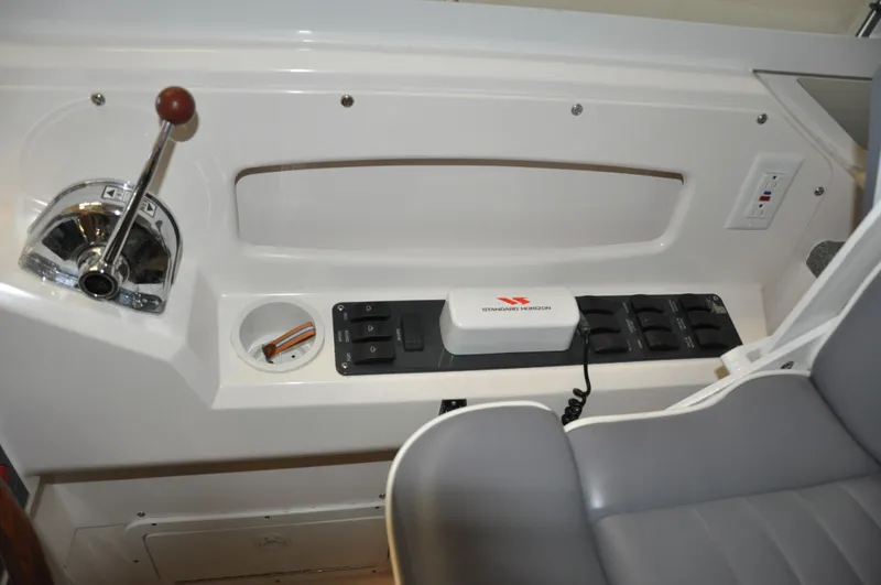Slide: The Image of Control panel of a 2005 True North 33 boat with throttle and switches. - 21