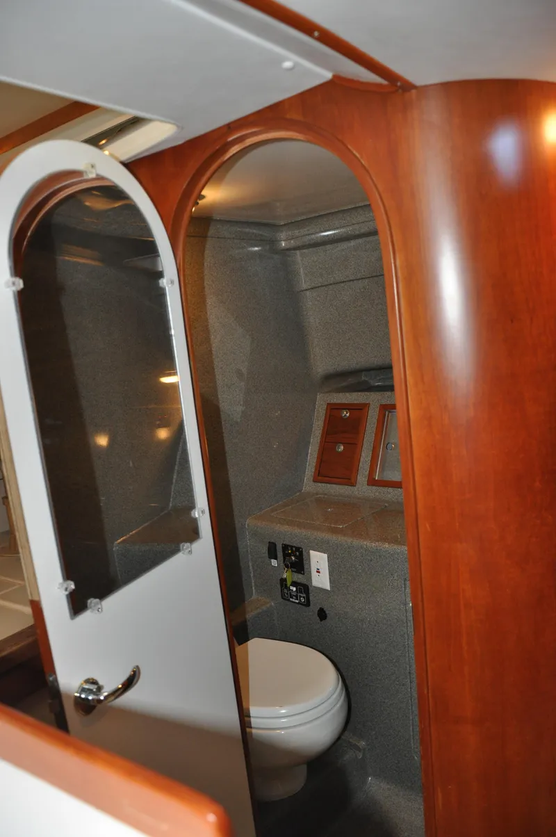 Slide: The Image of 2005 True North 33 yacht bathroom with wooden accents and modern fixtures. - 31