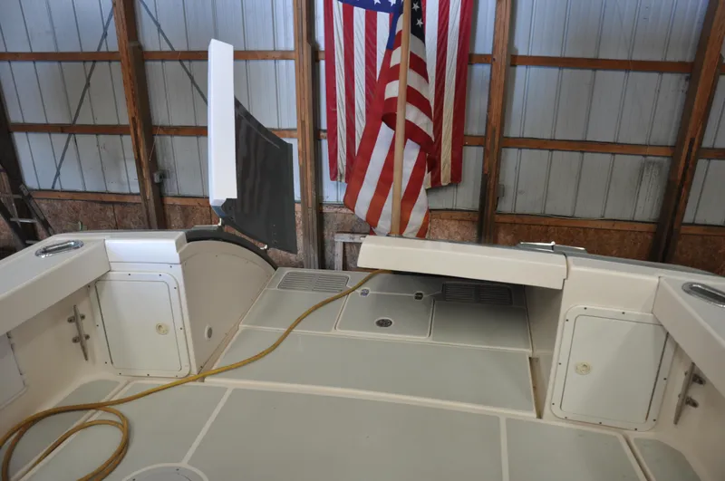Slide: The Image of Interior of 2005 True North 33 boat with American flag in background. - 33