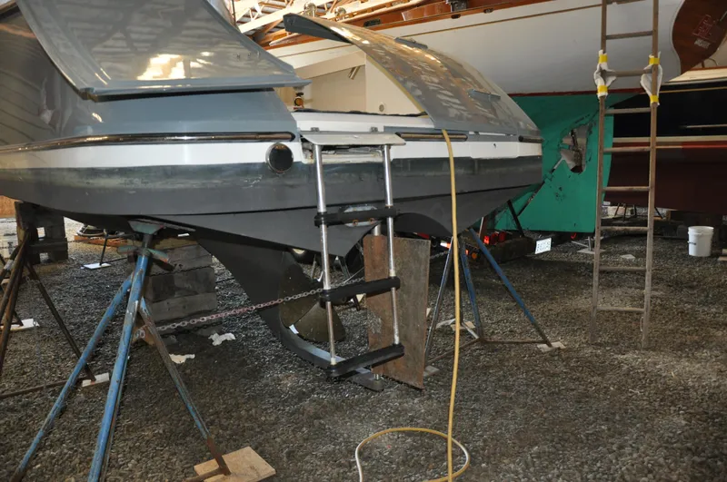 Slide: The Image of 2005 True North 33 boat on stands, showing rear view with ladder and hull details. - 40