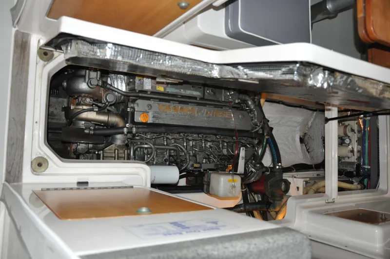 Slide: The Image of Engine compartment of a 2005 True North 33 boat, showcasing detailed mechanical components. - 41