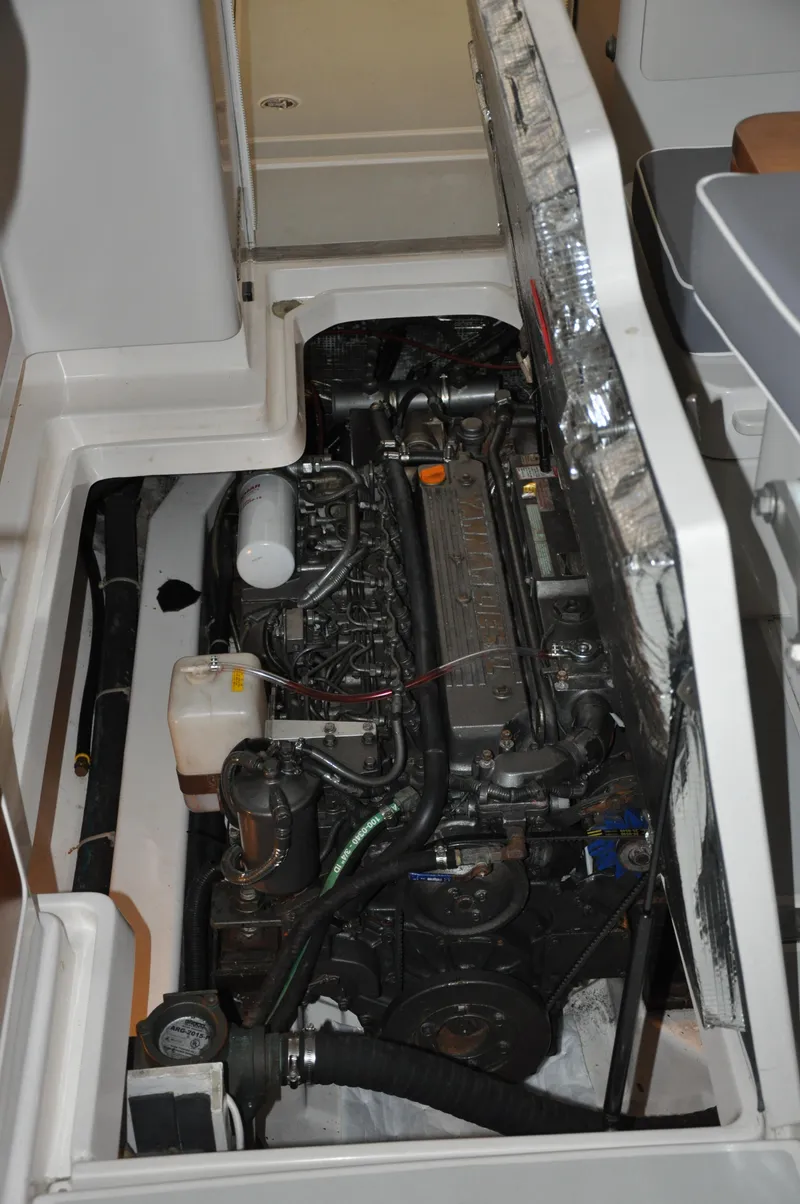 Slide: The Image of Engine compartment of a 2005 True North 33 boat, showcasing detailed mechanical components. - 45