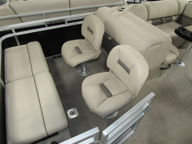 Slide: The Image of 2025 Sun Tracker Sport Fish 22 interior with beige seating and spacious layout. - 8