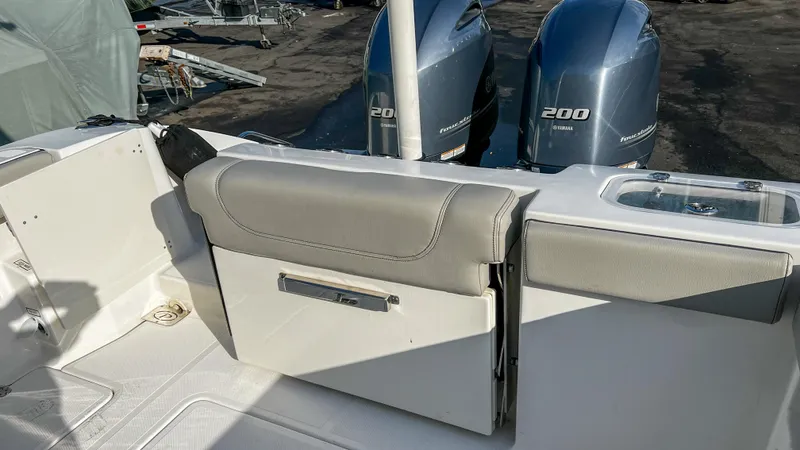 Slide: The Image of 2022 Pursuit S 268 boat interior with dual Yamaha 200 engines. - 20