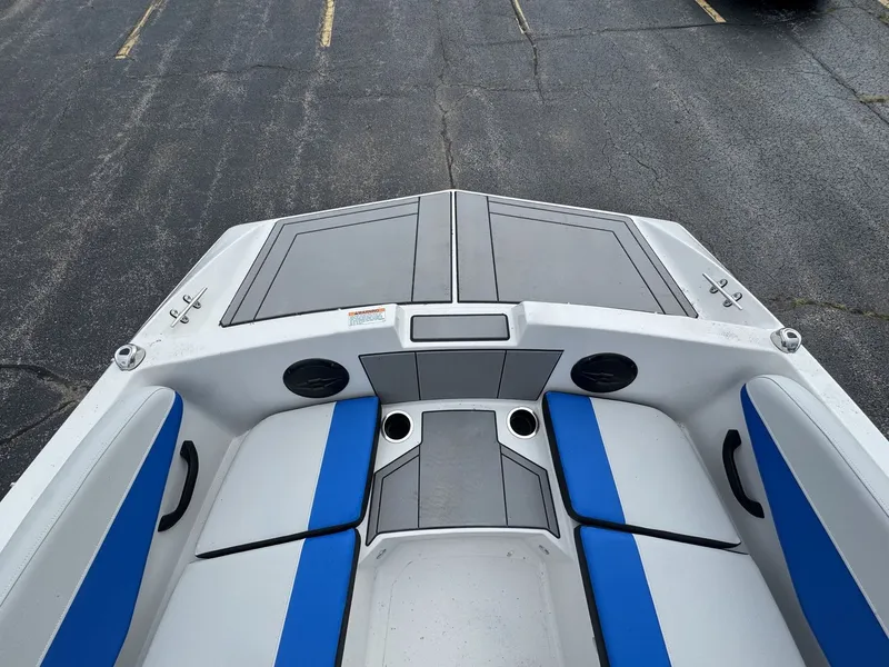 Slide: The Image of The image shows the cockpit of a 2025 Starcraft SV 16 OB with blue and gray seating. - 14