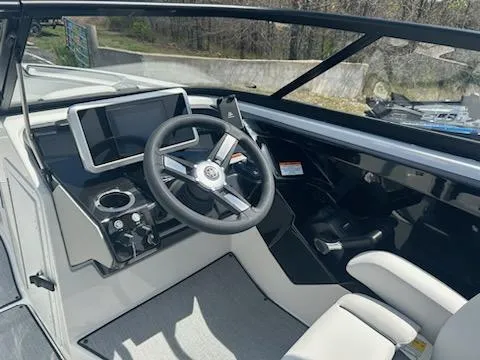 Slide: The Image of 2025 Yamaha AR250 boat cockpit with modern steering and touchscreen display. - 7