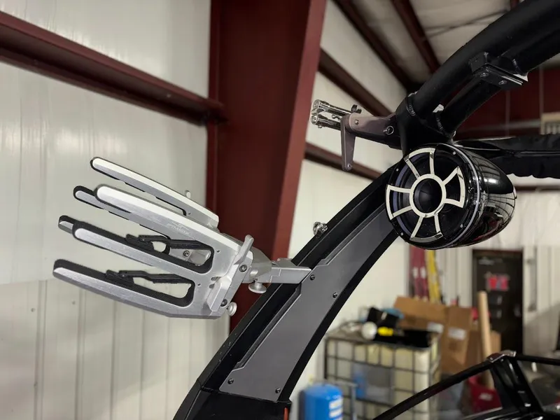 Slide: The Image of 2018 Tigé RZX3 boat tower with wakeboard rack and speaker in a garage setting. - 25