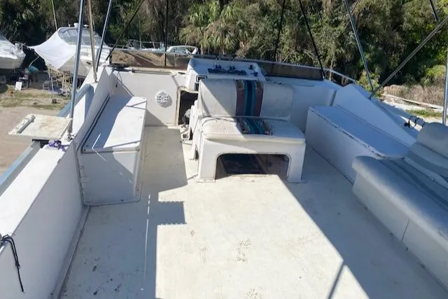 Slide: The Image of Upper deck of a 1989 Gibson 50 Classic boat with seating and control area. - 3