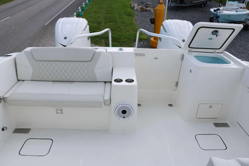 Slide: The Image of 2026 World Cat 325 DC boat interior with seating and storage compartments. - 21