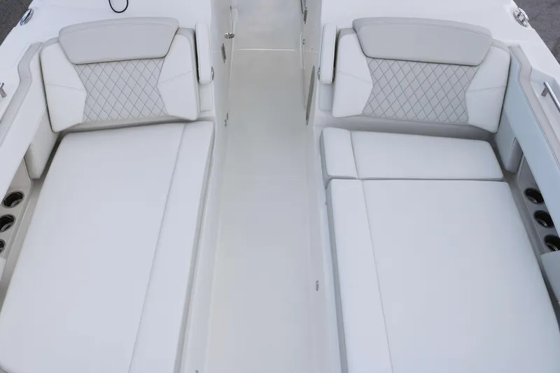 Slide: The Image of Luxurious seating on 2026 World Cat 325 DC boat, featuring elegant white upholstery. - 9