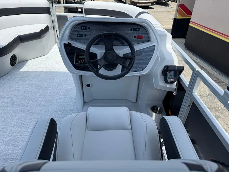 Slide: The Image of 2025 South Bay 18CR SE S Cruise boat interior with modern steering console and seating. - 15
