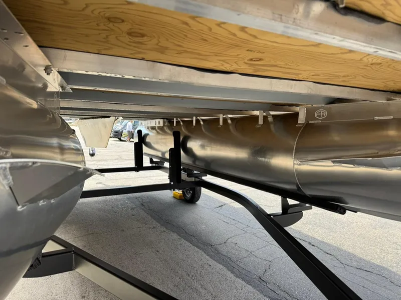 Slide: The Image of Underneath view of 2025 South Bay 18CR SE S Cruise pontoon boat on trailer. - 19