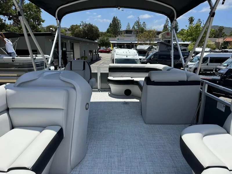 Slide: The Image of 2025 South Bay 18CR SE S Cruise pontoon boat with spacious seating and canopy. - 4