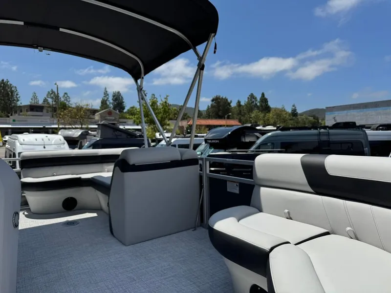 Slide: The Image of 2025 South Bay 18CR SE S Cruise pontoon boat interior with seating and canopy. - 6
