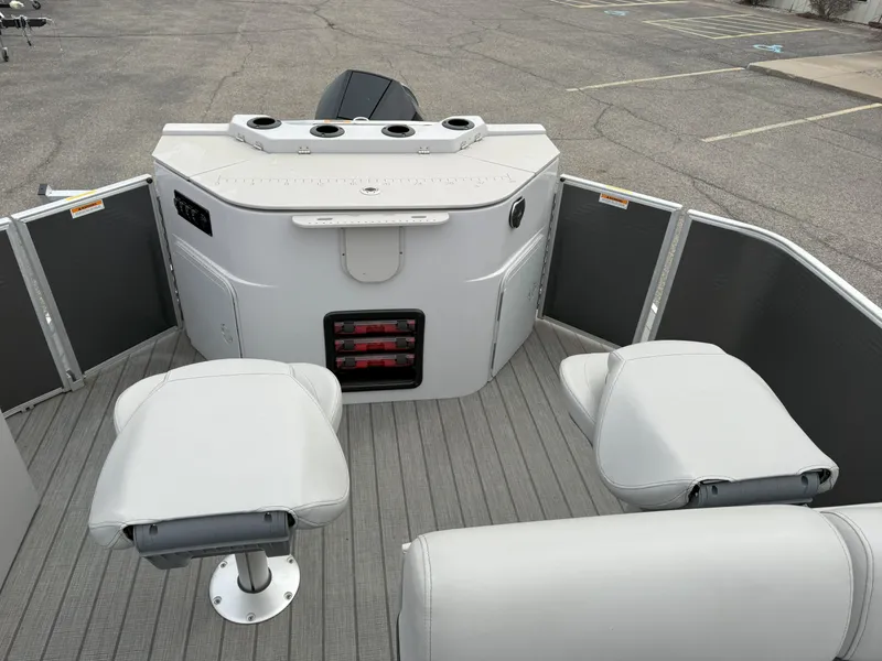 Slide: The Image of 2023 Godfrey Sweetwater 2286 FS boat interior with seating and storage compartments. - 13