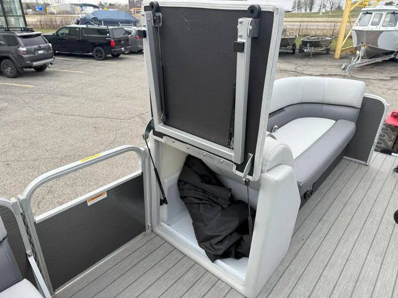 Slide: The Image of 2023 Godfrey Sweetwater 2286 FS pontoon boat with open storage compartment and seating. - 15
