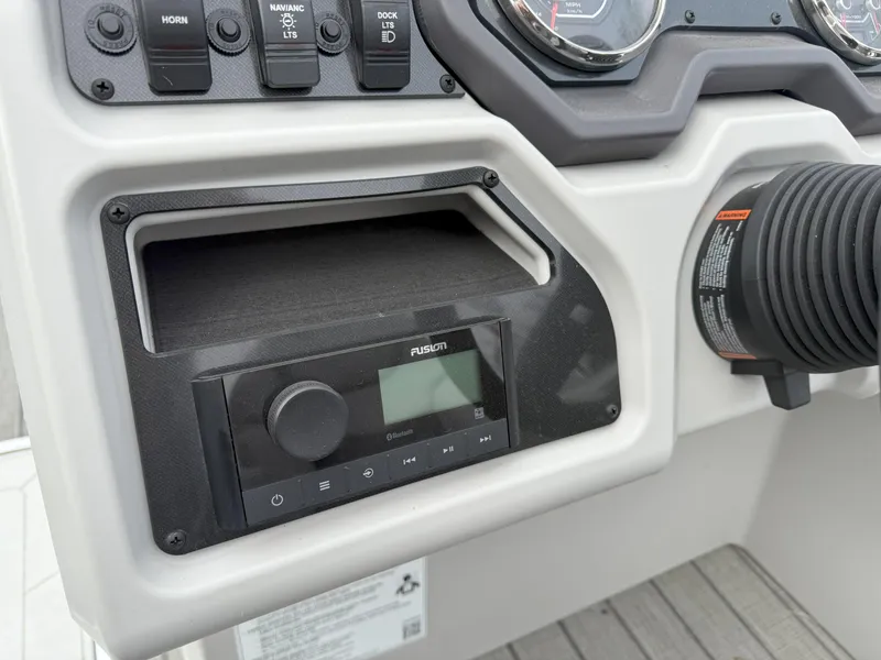 Slide: The Image of Control panel of 2023 Godfrey Sweetwater 2286 FS boat with Fusion audio system. - 16