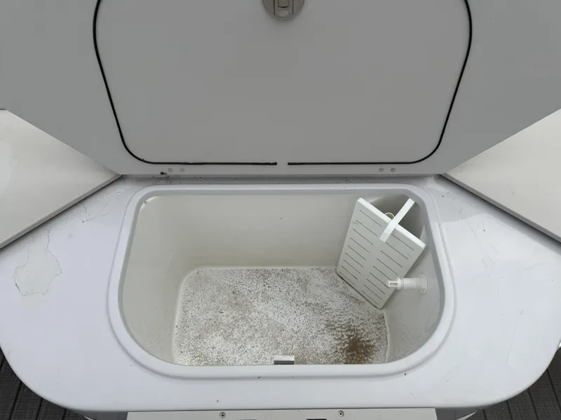 Slide: The Image of Open storage compartment on 2023 Godfrey Sweetwater 2286 FS boat. - 18