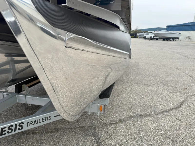 Slide: The Image of 2023 Godfrey Sweetwater 2286 FS pontoon boat on trailer, close-up view. - 22