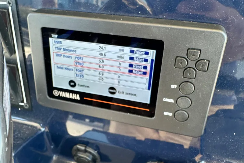Slide: The Image of Yamaha display on 2024 Pursuit S 268 boat showing trip data and settings. - 10