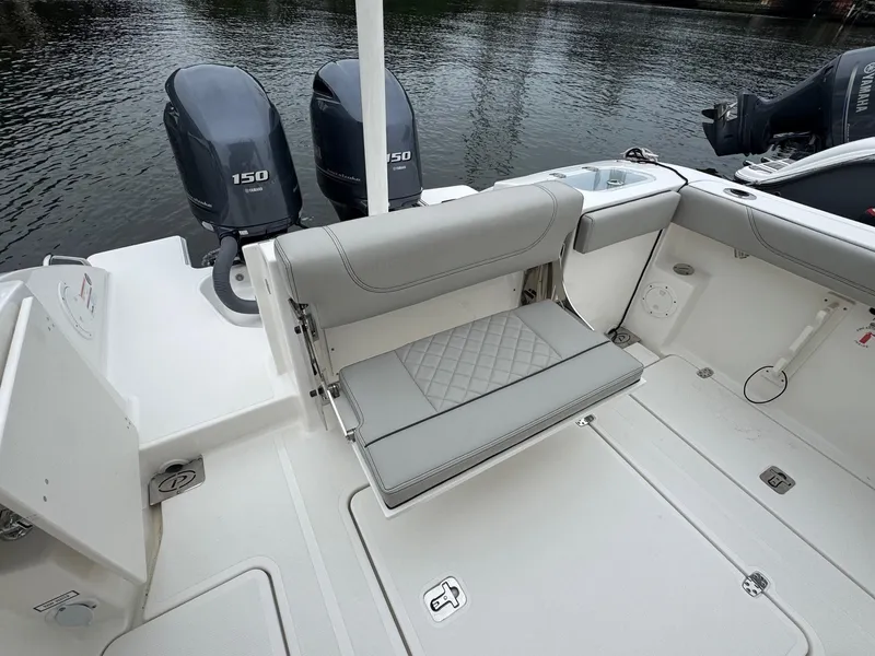 Slide: The Image of 2024 Pursuit S 268 boat with dual 150 engines and foldable seating. - 33