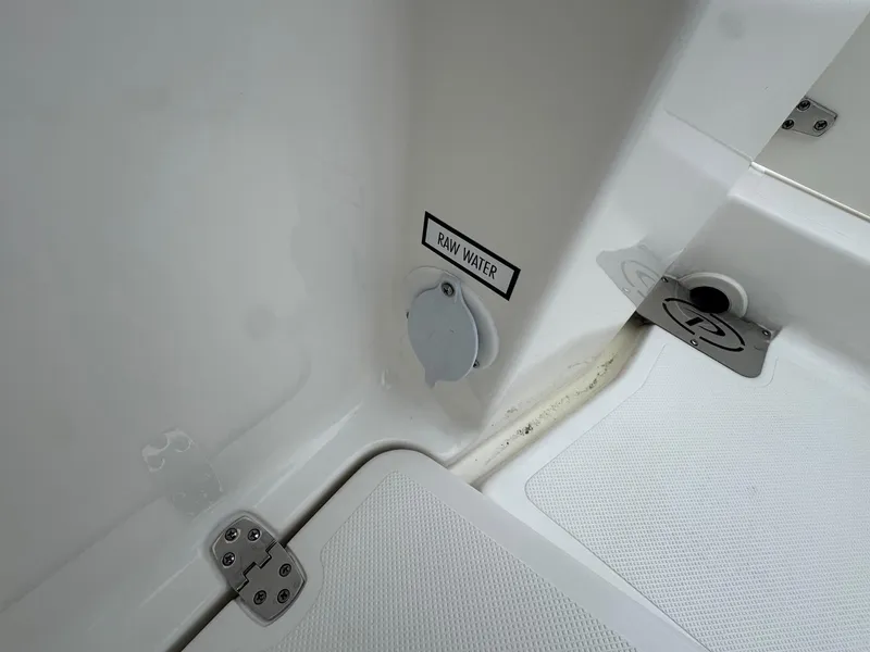 Slide: The Image of 2024 Pursuit S 268 boat raw water access point and deck details. - 37