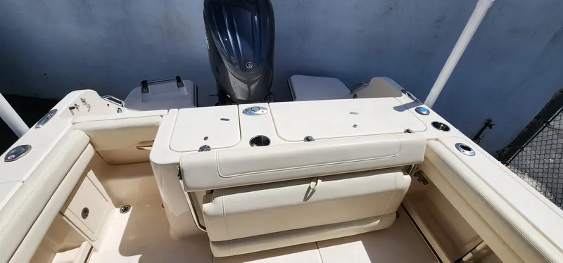 Slide: The Image of 2023 Grady-White Freedom 235 boat interior with seating and storage compartments. - 19