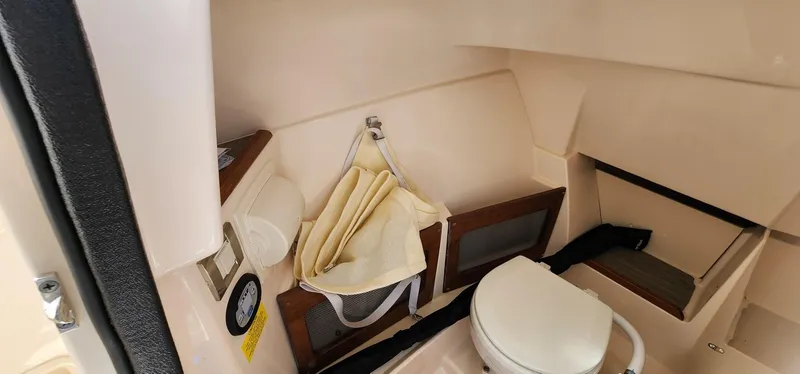Slide: The Image of 2023 Grady-White Freedom 235 boat interior with compact bathroom amenities. - 22