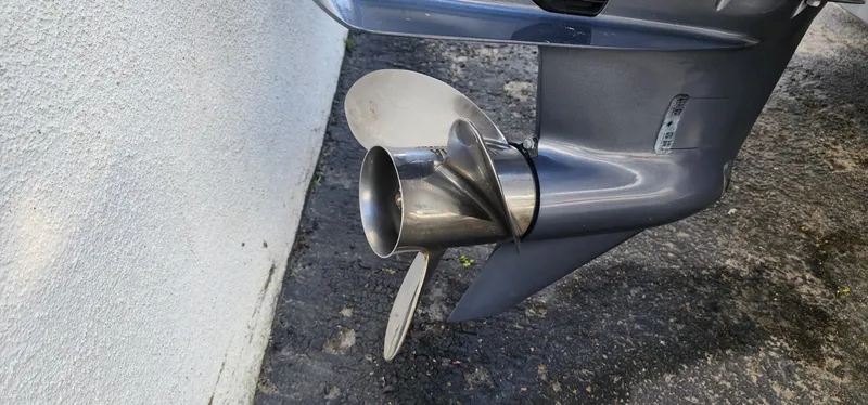 Slide: The Image of Outboard motor propeller of 2023 Grady-White Freedom 235 boat on concrete surface. - 28